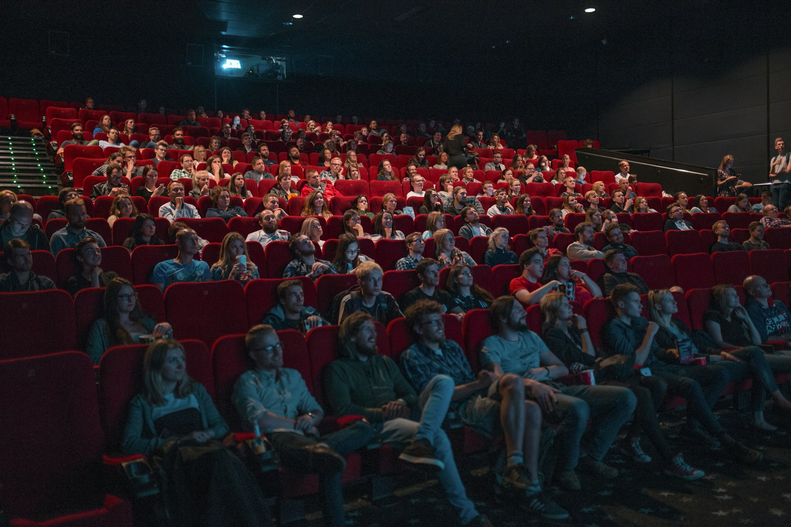 Full audience watching a film inside the cinema